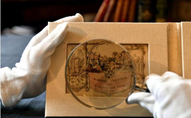 FOTO/ Cum arată prima felicitare de Crăciun din lume. Datează din anul 1843, iar iubitorii sărbătorilor de iarnă o pot admira în Londra