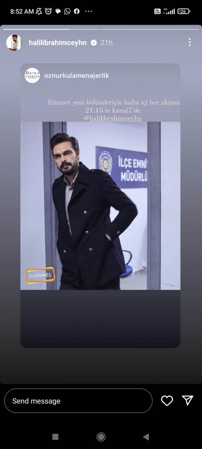 Halil Ibrahim Ceyhan poartă un costum negru și stă cu mâinile în buzunare