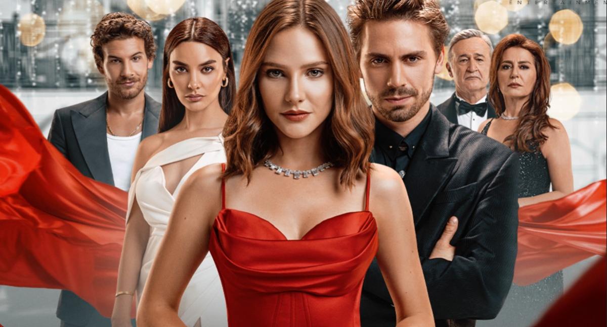 Protagonista serialului O poveste cu zâne, îmbrăcată într-o rochie roșie, alături de alte personaje din serial